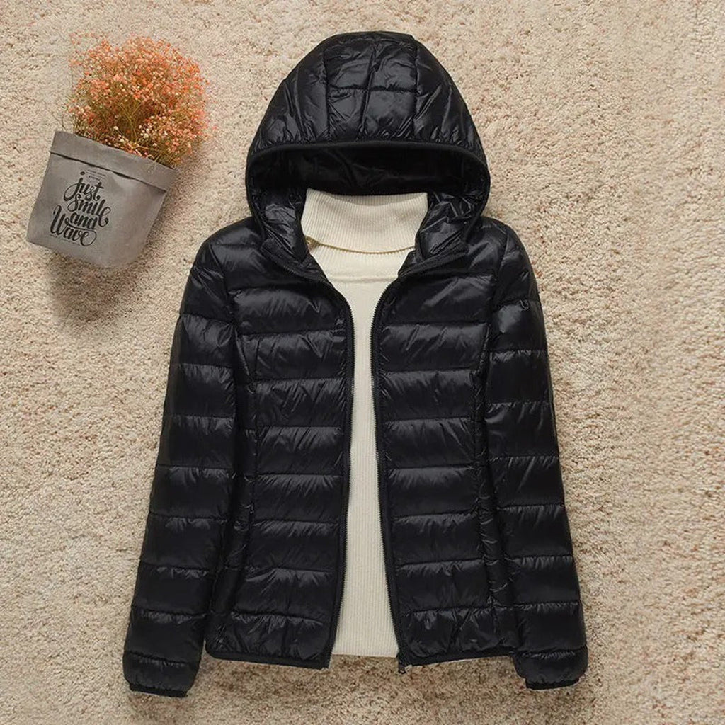 Women's black quilted puffer jacket with hood