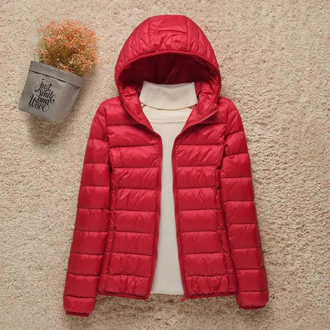 Women's red quilted puffer jacket with hood