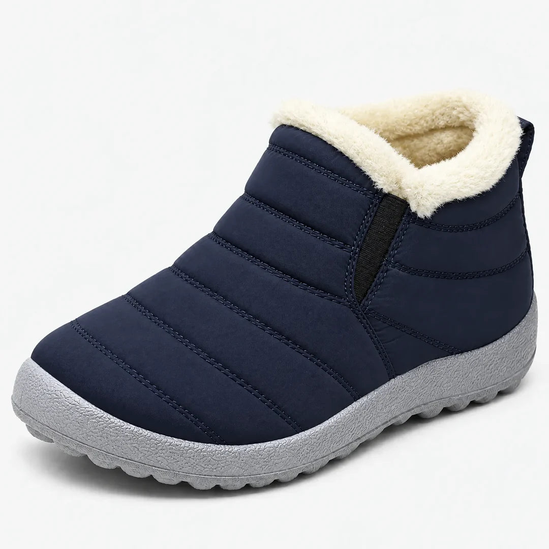 Women's navy quilted ankle boot with cream collar