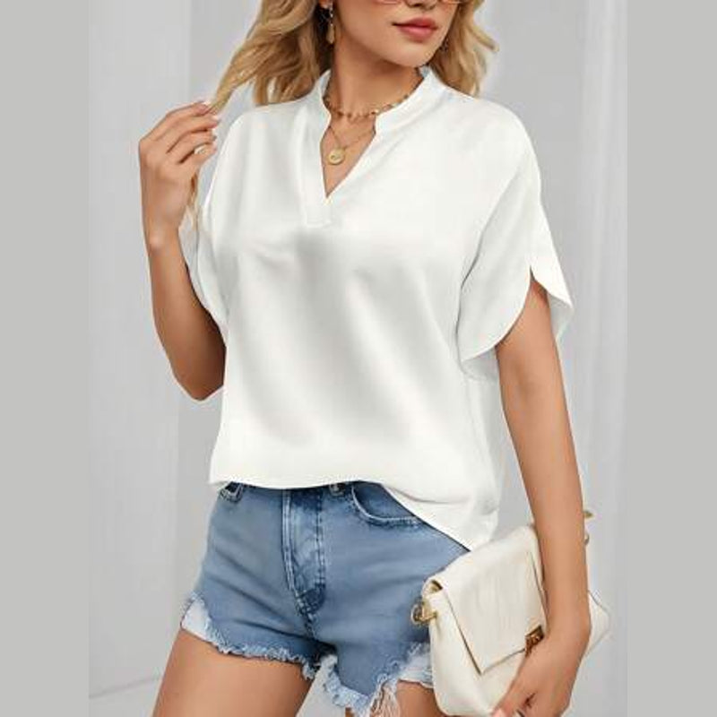 Woman wearing the white V-neck blouse with denim shorts