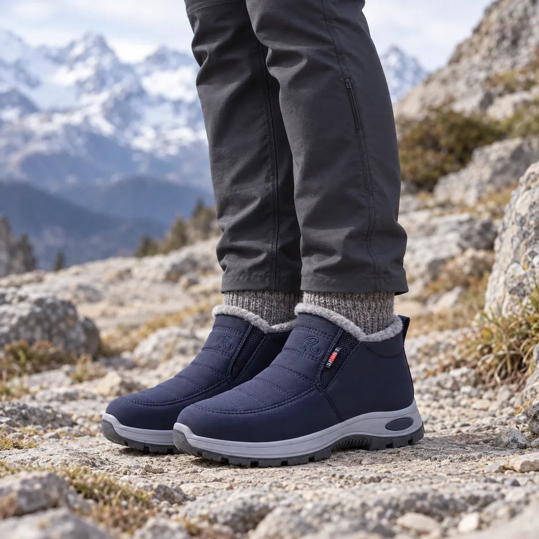Women's navy blue winter boots worn outdoors