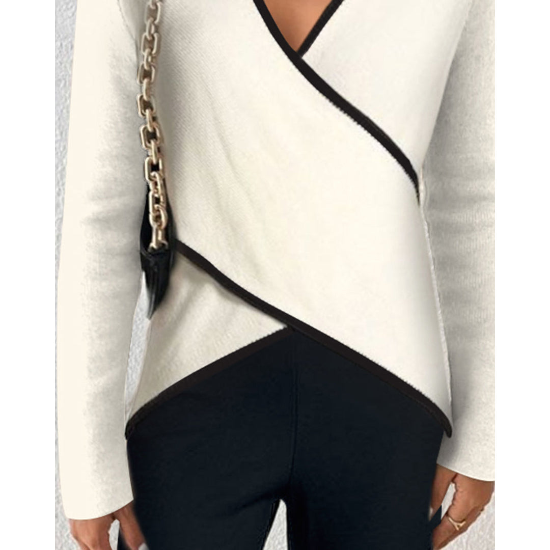 Close-up of the wrap hem on the women's cream sweater