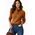 Women's brown cable knit sweater with button high neck and jeans