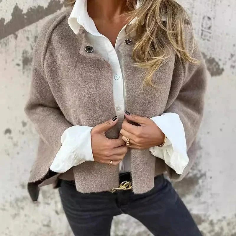 Women's taupe cropped knit jacket over a white shirt