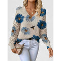 Woman in floral V-neck knit sweater with blue flowers