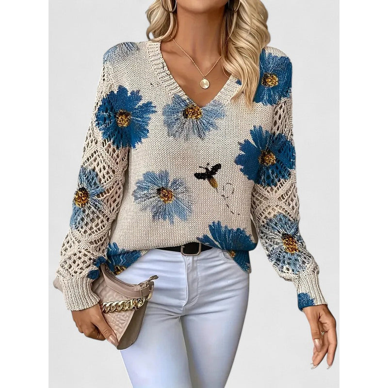 Woman in floral V-neck knit sweater with blue flowers