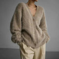 Women's beige fluffy V-neck cardigan with cream trousers