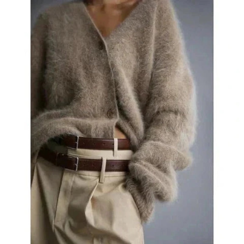 Beige fluffy cardigan tucked in with a brown belt