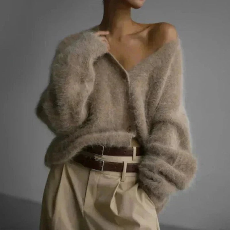 Beige fluffy V-neck cardigan worn off the shoulder