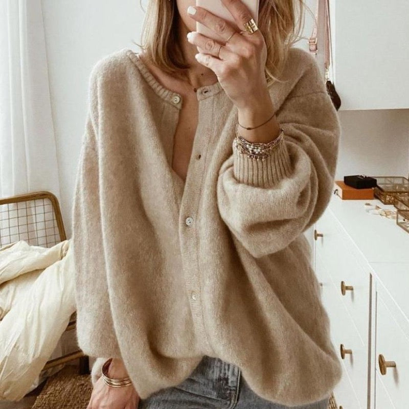 Women's beige oversized button cardigan with jeans