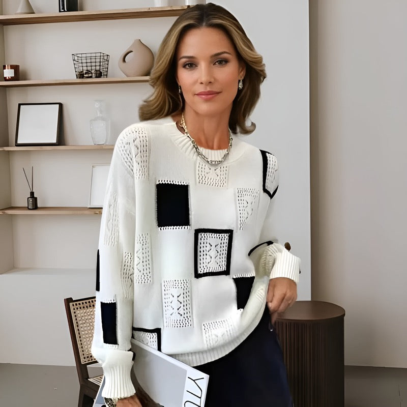 Women's white crew neck sweater with black square patchwork print