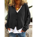 Black V-neck button cardigan over a white top