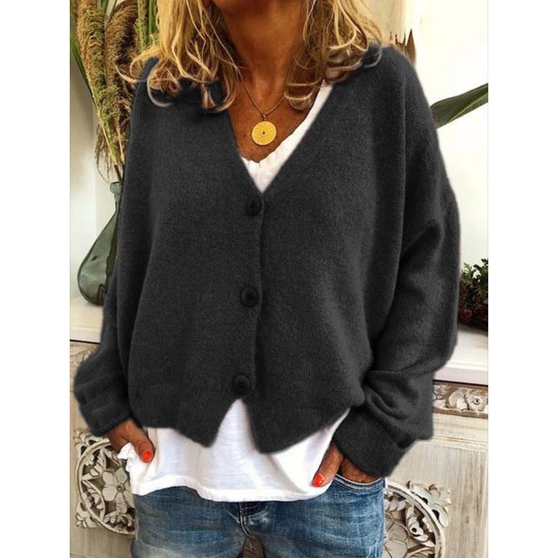 Black V-neck button cardigan over a white top
